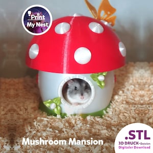 May include: A red and white mushroom-shaped hamster house with a small hamster peeking out of a round window. The house has a butterfly decoration and the text "Mushroom Mansion". The house is surrounded by wood shavings.