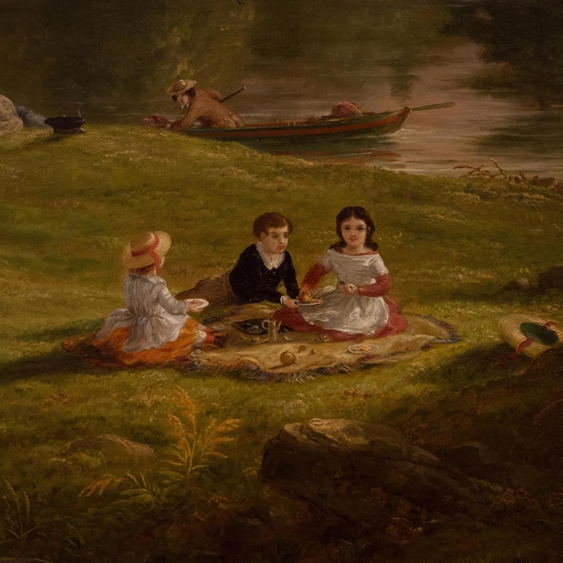 May include: Three children sit on a blanket in a grassy field, enjoying a picnic. A man in a boat rows away in the background. The children are dressed in 19th-century clothing and are eating from plates.