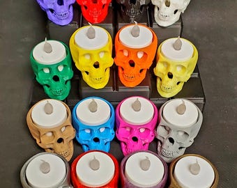 Bring a spooky glow to your space with these vibrant 3D printed skull candle holders!