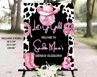 May include: A party sign with a black background and a cow print border. The sign says "Let's Go Girls!" and "Welcome to Sadie Mae's Birthday Celebration." Pink cowboy boots, a guitar, and a cowboy hat are featured.