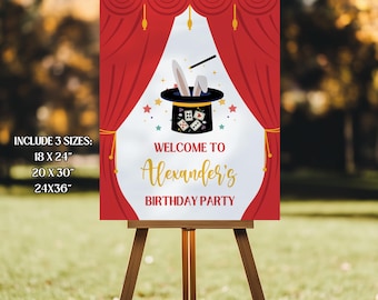 May include: A red and white birthday party sign on an easel. The sign features a magician's hat with a rabbit and dice, and the text "Welcome to Alexander's Birthday Party." The sign includes the sizes 18 x 24", 20 x 30", and 24x36".