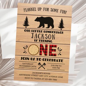 May include: A rustic wood-grain background with a red and black plaid pattern. The text "Flannel Up For Some Fun!" is at the top. The text "Our Little Lumberjack Jackson Is Turning One" is in the center. The text "Join Us To Celebrate" is below the number "One". The text "Saturday November 24th" is below the text "Join Us To Celebrate". The text "2:00 PM to 4:00 PM" is to the right of the text "Saturday November 24th". The text "Jackson's House Anywhere Street Any City Avenue 12345 RSVP To Taisha At 123-456-7890" is at the bottom.