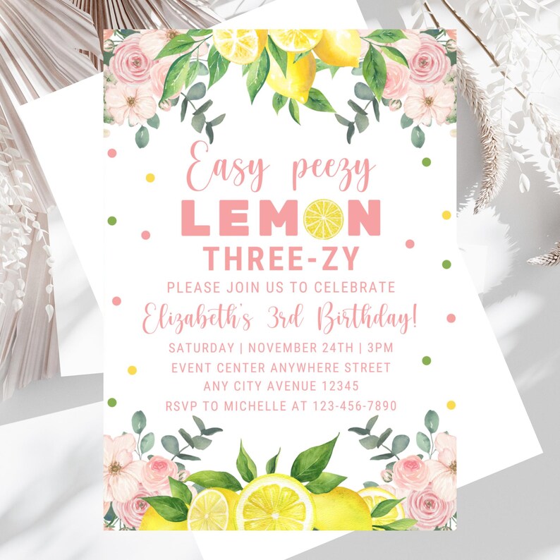 May include: A lemon-themed birthday invitation featuring pink flowers, green leaves, and yellow lemons. The text reads "Easy peezy LEMON THREE-ZY. Please join us to celebrate Elizabeth's 3rd Birthday! Saturday | November 24th | 3PM. Event Center Anywhere Street. Any City Avenue 12345. RSVP to Michelle at 123-456-7890."