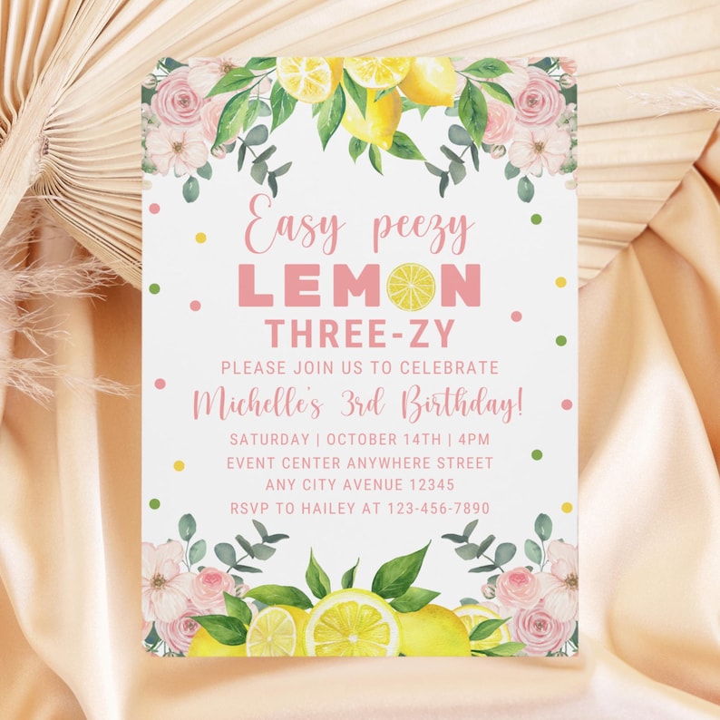 May include: A pink and white birthday invitation with a lemon theme. The invitation says "Easy peezy LEMON THREE-ZY" and includes the text "Please join us to celebrate Michelle's 3rd Birthday!"  The invitation also includes the date, time, and location of the party.