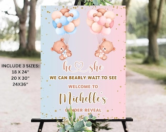 May include: A gender reveal party sign with a pink and blue ombre background. The sign features two teddy bears holding balloons, one blue and one pink. The text on the sign reads "he she we can bearly wait to see welcome to Michelle's gender reveal".
