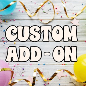 May include: A white background with gold ribbon and colorful confetti. The text "CUSTOM ADD-ON" is in large, white, outlined letters.