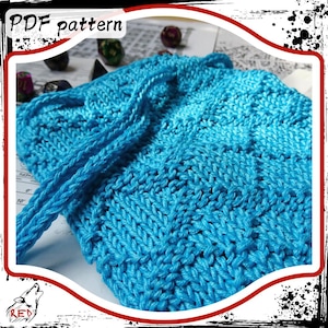 May include: A bright blue knitted dice bag with a drawstring closure. The bag is made with a textured stitch pattern and is perfect for storing dice.