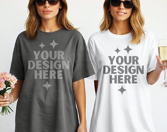 May include: Two women wearing oversized t-shirts with the text "Your design here" printed on the front. The shirts are in gray and white.