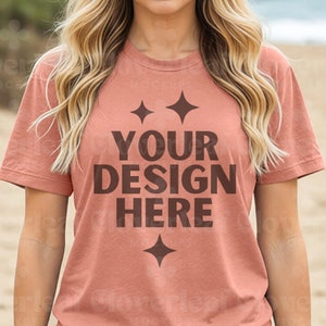 May include: A terracotta colored t-shirt with a brown graphic that says "YOUR DESIGN HERE" with two stars above the text and one star below the text.