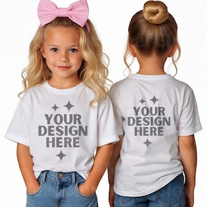 May include: Two white t-shirts with short sleeves. The front of one shirt says "YOUR DESIGN HERE" with small stars. The back of the other shirt says "YOUR DESIGN HERE" with small stars.