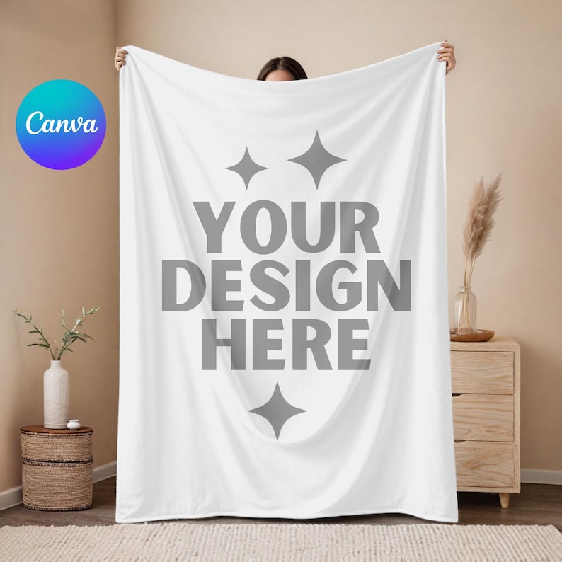 May include: White throw blanket with the text "YOUR DESIGN HERE" in gray. Two small gray stars are above the text and one is below.