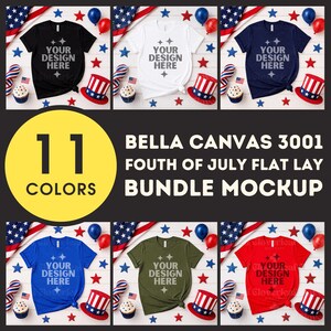 May include: A flat lay mockup showcasing Bella Canvas 3001 t-shirts in a range of colours, such as black, white, and navy. Each shirt displays the text "YOUR DESIGN HERE" and is styled with patriotic decorations, including flags, hats, and balloons.