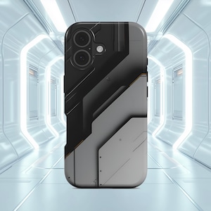 Peut inclure: Une coque de smartphone au design géométrique futuriste. La coque présente une combinaison de panneaux noirs, gris et blancs avec de subtils accents orange. Le design intègre des formes angulaires et un aspect texturé, lui donnant une esthétique moderne inspirée de la technologie.