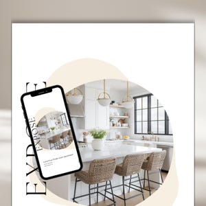 May include: A white kitchen with a large island and bar stools. The island has a white countertop and a white backsplash. There are three pendant lights hanging over the island. The kitchen has white cabinets and a black window.