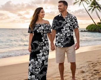 May include: Matching black and white floral print outfits. A woman wears an off-the-shoulder maxi dress, and a man wears a button-down shirt and khaki shorts. They are holding hands on a beach with palm trees.