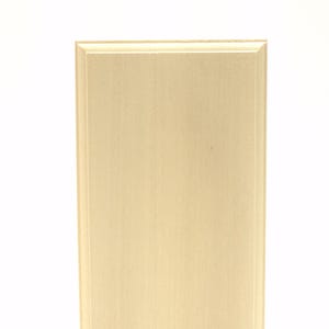 May include: A rectangular wooden plaque with a light beige finish. The plaque has a beveled edge and a smooth, unadorned surface, suitable for engraving or displaying artwork. The wood grain is subtly visible.