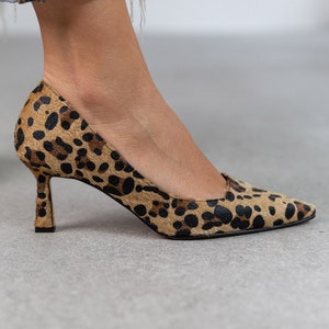 May include: A handmade wooden sign with the text "Welcome" in a playful font. The sign is painted white with a distressed finish, and features a small, decorative heart. It's designed for indoor or outdoor use.