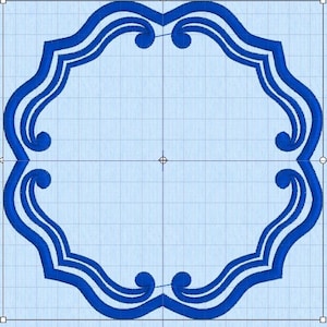 May include: A blue embroidered frame design with a scalloped edge and scroll details. The frame is centered on a light blue grid background, suitable for embroidery or digital design projects.