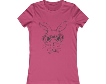 May include: A pink women's t-shirt with a black and white illustration of a rabbit wearing sunglasses and a bow tie.