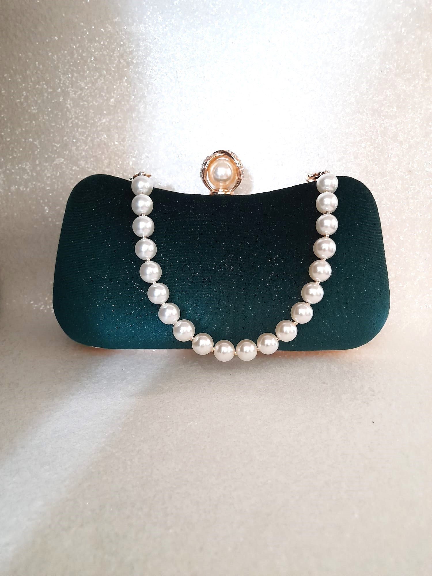 Green velvet shop clutch bag