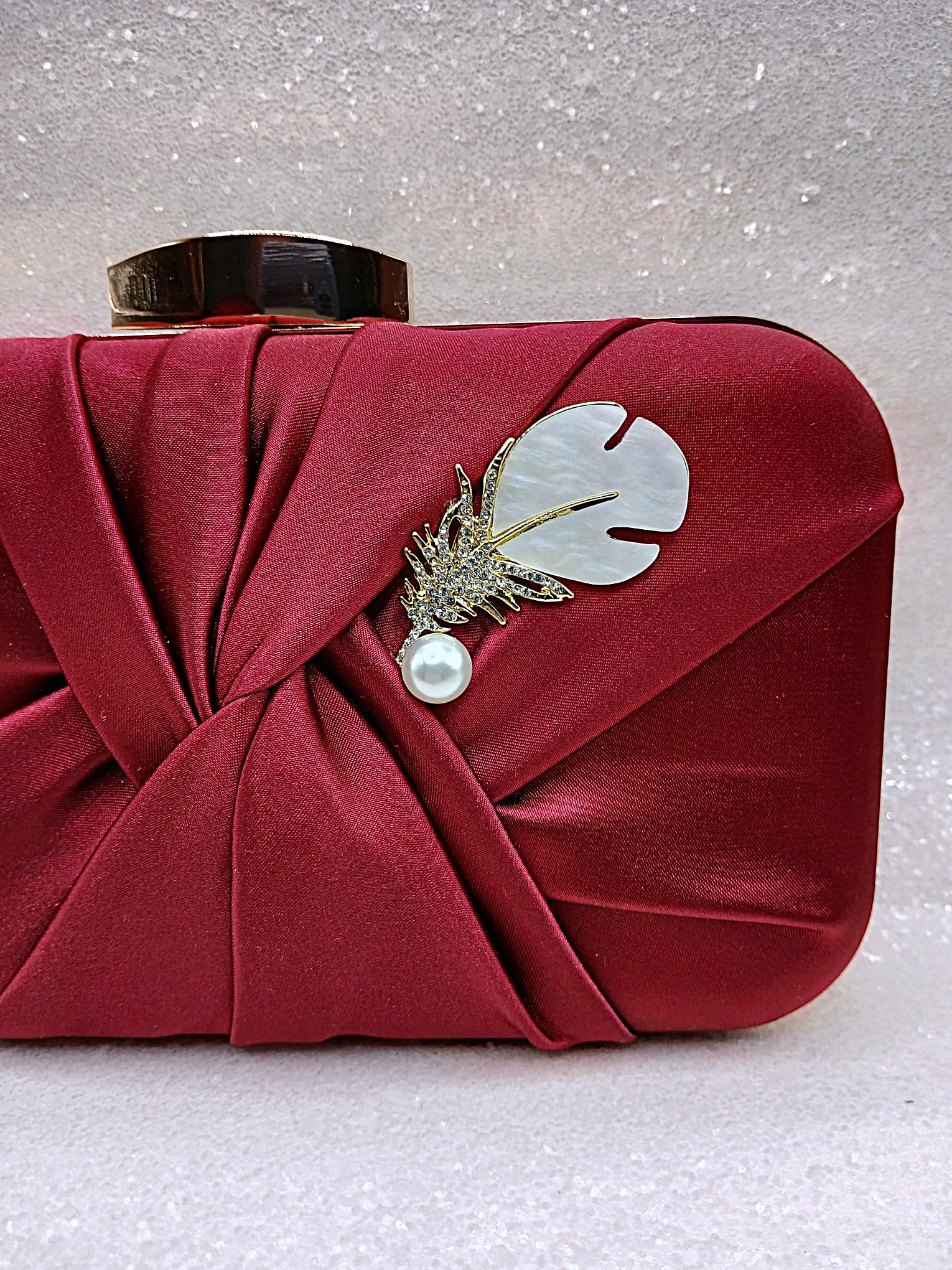 Burgundy and gold clutch bag hotsell