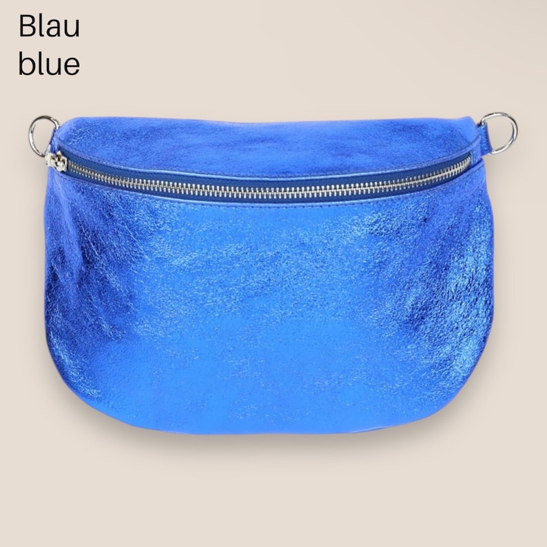 May include: A bright blue metallic fanny pack with a silver zipper. The bag has a curved shape and a silver buckle on each side.
