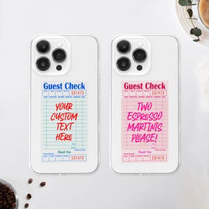 May include: Two phone cases with a white background. The cases are clear and have a design on the back. The design is a pink and blue guest check with the text "Guest Check" and "561470". The left case has the text "Your Custom Text Here" and the right case has the text "Two Espresso Martinis Please!"
