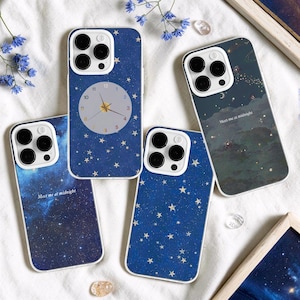 May include: Four smartphone cases featuring celestial designs. One case displays a clock face on a blue starry background. Two cases show deep blue starry night skies, one with the text "Meet me at midnight". The fourth case depicts a dark cloudy night sky.
