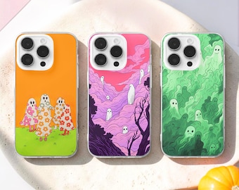 May include: Three smartphone cases featuring distinct designs: one with orange background and floral ghosts, one with a pink and purple cloudy landscape with white ghosts, and one with a green monochromatic pattern of multiple small ghost figures.