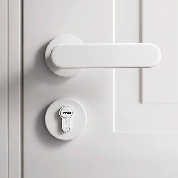 White sleek door lever, simple door lock, minimalistic silent door lever, modern interior door handle, stylish hardware