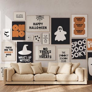 May include: A selection of Halloween-themed wall art featuring bats, ghosts, and witch hats. Text includes "Happy Halloween" and "No Tricks Just Treats." A beige sofa is positioned below the framed artwork, creating a seasonal display.