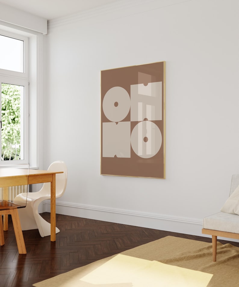 May include: A brown framed print with the word "OH NO" in white letters on a beige background. The letters are made up of geometric shapes.