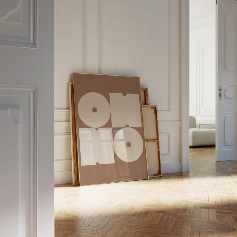 May include: A framed abstract art print with a brown background and white geometric shapes. The print features the word "ONO" in white letters.