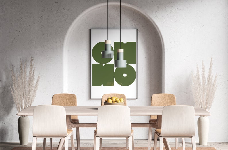May include: A dining room with a wooden table and six chairs. The table is set with a bowl of lemons. A framed print with geometric shapes in green and white hangs on the wall. Two tall vases with dried pampas grass are on either side of the table.
