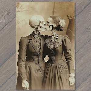 May include: Sepia-toned print of two skeletons in vintage clothing, embracing and kissing. The skeleton on the left wears a suit with a bow tie, while the skeleton on the right wears a dress with a floral hair accessory. The image evokes a gothic or Halloween theme.