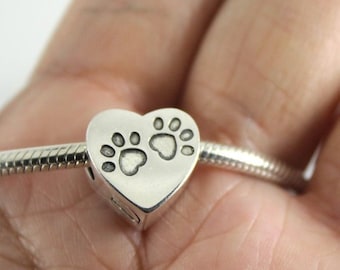 Dije de corazón con huella de pata - Joyería de cremación para cenizas de mascotas