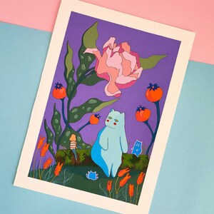 May include: A whimsical illustration of a blue cat sitting on a log with a small blue cat and a girl in a striped shirt. The background is a purple sky with a large pink flower and green leaves.