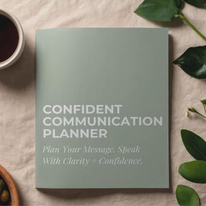 May include: A sage green planner featuring the white text CONFIDENT COMMUNICATION PLANNER and the subtitle Plan Your Message. Speak With Clarity + Confidence. The cover has a matte finish and a rectangular shape, presenting a clean and professional look.