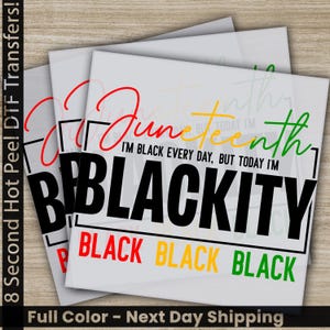 May include: Stacked white square transfers with the words "Juneteenth" in red, yellow, and green script. The phrase "I'M BLACK EVERY DAY, BUT TODAY I'M BLACKITY" is printed in black. The word "BLACK" is repeated in red, yellow, and green.
