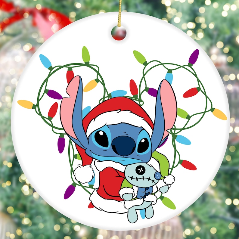 A Christmas ornament featuring a cartoon character wearing a Santa hat and holding a small stuffed animal.