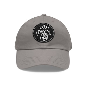 May include: A gray baseball cap with a black and white patch that says "PICC'N King" with a crown above the text.