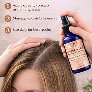 May include: A blue spray bottle of Copper & Leaf Ayurvedic Leave-In Hair Serum is held near a person's head. The bottle has a black spray nozzle and a label with product information. The text "HOW TO USE" is at the top, with instructions to apply, massage, and use daily.