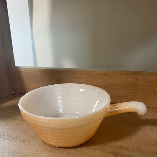 Anchor Hocking Fireking Peach Lustreware soup bowl with handle