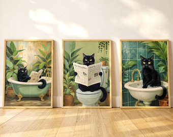 May include: Three framed art prints featuring black cats in bathroom settings. One cat is in a bathtub, another on a toilet, and the third at a sink. Each cat is reading a newspaper. The backgrounds include plants and green and white tiles.