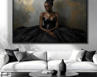 May include: A framed canvas art print featuring a portrait of a person in a black strapless gown. The person has dark skin and is looking down. The background has a mix of gray and gold tones. The artwork is displayed above a white sofa.