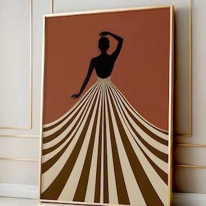 May include: Framed art print depicting a black silhouette of a person in a striped dress against a rust-coloured backdrop. The dress has a flowing design with brown and cream stripes. The frame is gold.