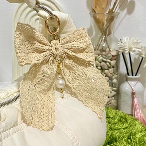 Elegant Lace Bow Keychain, Cute Ribbon Bag Charm with Pearl Bead, Handmade Lace Charm Accessory for Gift, Girly Coquette Keyring for handbag