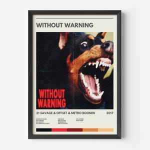 May include: Framed poster featuring the text "WITHOUT WARNING" and a snarling dog. The poster also includes "21 SAVAGE & OFFSET & METRO BOOMIN" and the year "2017". The poster is in a black frame against a neutral background.
