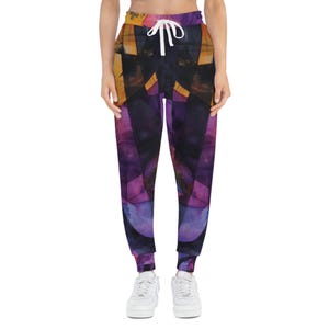 May include: Purple, black, and orange abstract print sweatpants with a white drawstring.