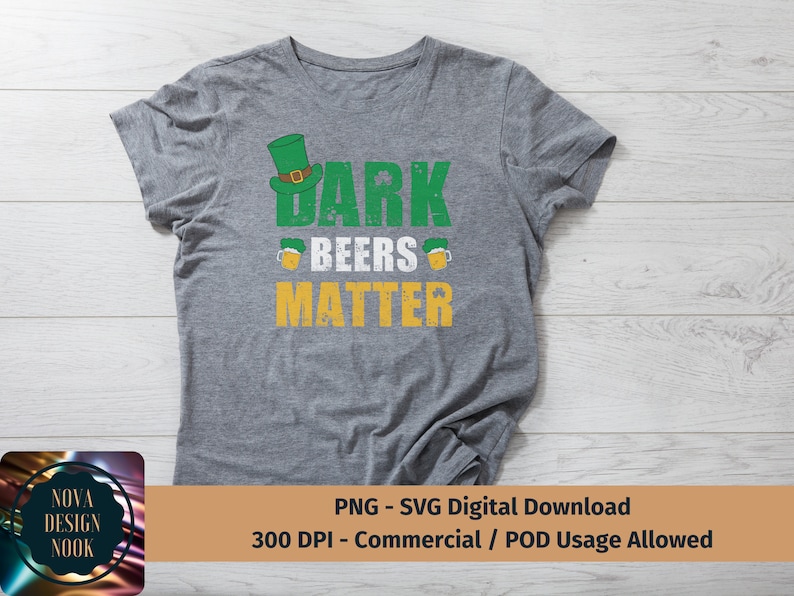May include: A gray t-shirt with a distressed green, yellow, and white graphic that says "Dark Beers Matter". The graphic includes a cartoon leprechaun hat.